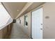 A clean hallway with tiled floors and a white door at 5200 Brittany S Dr # 1708, St Petersburg, FL 33715