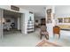 Living room with vintage furniture and a view of the bedroom at 5200 Brittany S Dr # 1708, St Petersburg, FL 33715