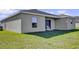Home features a private backyard with grassy area at 6731 Wirevine Dr, Brooksville, FL 34602