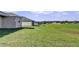Landscaped backyard with golf course views at 6731 Wirevine Dr, Brooksville, FL 34602