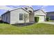 House exterior with neutral paint, two-car garage, and landscaping at 6731 Wirevine Dr, Brooksville, FL 34602