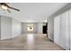 Open concept living room with vinyl flooring and backyard access at 6731 Wirevine Dr, Brooksville, FL 34602