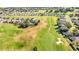 Aerial view of a golf course and surrounding houses at 6731 Wirevine Dr, Brooksville, FL 34602