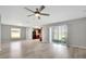 Open living area with vinyl flooring, ceiling fan, and kitchen views at 6731 Wirevine Dr, Brooksville, FL 34602