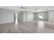 Living room with hardwood flooring, ceiling fan, and view of kitchen at 6731 Wirevine Dr, Brooksville, FL 34602