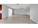 Spacious living area with vinyl plank flooring and a view of the kitchen at 6731 Wirevine Dr, Brooksville, FL 34602