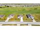 Three houses on a street with a golf course in the background at 6731 Wirevine Dr, Brooksville, FL 34602