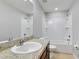 Modern bathroom with tub, toilet, and vanity at 6731 Wirevine Dr, Brooksville, FL 34602
