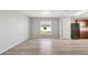 Bright dining area with wood-look floors and large window at 6731 Wirevine Dr, Brooksville, FL 34602