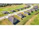 Several houses with a golf course in the background at 6731 Wirevine Dr, Brooksville, FL 34602