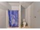 Bathroom with shower stall, toilet, and a curtain at 7923 18Th E Ave, Palmetto, FL 34221
