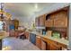Kitchen with wood cabinets, appliances, and an island at 7923 18Th E Ave, Palmetto, FL 34221