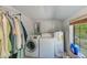 Functional laundry room with washer, dryer, and ample storage at 7923 18Th E Ave, Palmetto, FL 34221
