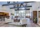 Spacious clubhouse with high ceilings, comfortable seating, a bar area, and large windows overlooking the pool at 10100 Sailwinds N Blvd # 106, Largo, FL 33773