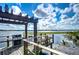 Wooden dock on the lake featuring a grill and a sitting area at 10100 Sailwinds N Blvd # 106, Largo, FL 33773