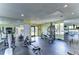 Well-equipped gym with exercise machines, free weights, and mirrored walls for a comprehensive workout experience at 10100 Sailwinds N Blvd # 106, Largo, FL 33773