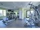 Well-equipped fitness center featuring modern exercise machines, mirrors, and ample space for a complete workout at 10100 Sailwinds N Blvd # 106, Largo, FL 33773
