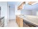 Kitchen featuring granite countertops, wood cabinets, and stainless steel appliances at 10100 Sailwinds N Blvd # 106, Largo, FL 33773