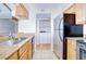 Open kitchen with granite countertops, wood cabinets and modern appliances at 10100 Sailwinds N Blvd # 106, Largo, FL 33773