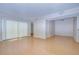 Bright living room with wood flooring and sliding doors at 10100 Sailwinds N Blvd # 106, Largo, FL 33773