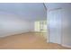 Bright living room featuring wood floors and sliding glass doors that provide ample natural light at 10100 Sailwinds N Blvd # 106, Largo, FL 33773