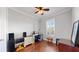 Bright home office features wood floors, built-in shelving and window with plantation shutters at 11101 58Th Street E Cir, Parrish, FL 34219