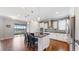 Island kitchen features granite countertops, stainless steel appliances, and white cabinetry at 11101 58Th Street E Cir, Parrish, FL 34219