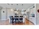Modern kitchen with white cabinets, granite countertops, and stainless steel appliances at 11101 58Th Street E Cir, Parrish, FL 34219