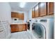 Bright laundry room with washer, dryer and ample storage at 11101 58Th Street E Cir, Parrish, FL 34219