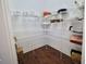 Walk-in pantry with ample shelving for storage at 11101 58Th Street E Cir, Parrish, FL 34219