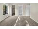 Bedroom with neutral carpeting and double closets at 1127 Pine Ridge W Cir # A2, Tarpon Springs, FL 34688