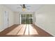 Spacious living room with sliding doors to balcony at 1127 Pine Ridge W Cir # A2, Tarpon Springs, FL 34688