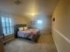 Spacious bedroom with a large bed at 12013 Whistling Wind Dr, Riverview, FL 33579