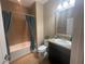 Clean bathroom with tub, shower, and updated vanity at 12013 Whistling Wind Dr, Riverview, FL 33579