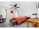 Cozy bedroom with coral bedding and a wooden desk at 1940 72Nd Ne Ave, St Petersburg, FL 33702