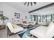 Bright living room with white couches and large windows at 1940 72Nd Ne Ave, St Petersburg, FL 33702