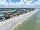 Aerial view showcasing beachfront home and surrounding area at 19807 Gulf Blvd # 128, Indian Shores, FL 33785