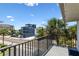 Balcony with view of the street and partial ocean view at 19807 Gulf Blvd # 128, Indian Shores, FL 33785
