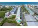 Aerial view showing condo community, pool, and beach access at 19807 Gulf Blvd # 128, Indian Shores, FL 33785
