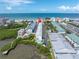 Aerial view of condo complex with beach and waterway views at 19807 Gulf Blvd # 128, Indian Shores, FL 33785