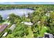 Aerial view of a lakefront property surrounded by lush greenery and serene waters at 20333 Moss Branch Ct, Lutz, FL 33558
