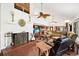 Spacious living room area, showcasing a fireplace, an open floor plan, and exposed brick flooring at 20333 Moss Branch Ct, Lutz, FL 33558