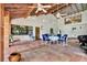 Outdoor patio with tile flooring, ample seating, and ceiling fans to keep you cool and comfortable at 20333 Moss Branch Ct, Lutz, FL 33558