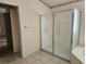 Bathroom with shower stall and adjacent to bedroom at 2421 E Del Webb Blvd, Sun City Center, FL 33573
