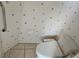 Small bathroom with seashell decor and modern toilet at 2421 E Del Webb Blvd, Sun City Center, FL 33573