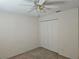 Simple bedroom with double door closet and ceiling fan at 2421 E Del Webb Blvd, Sun City Center, FL 33573