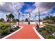Brick pathway leads to a community monument with flags at 2421 E Del Webb Blvd, Sun City Center, FL 33573