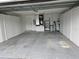 Attached garage with extra storage and AC unit at 2421 E Del Webb Blvd, Sun City Center, FL 33573