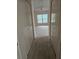 Hallway with carpet flooring and access to bedrooms at 2421 E Del Webb Blvd, Sun City Center, FL 33573