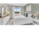Spacious bedroom with white bedding and a dresser at 2460 Mellow Ln, Clearwater, FL 33765